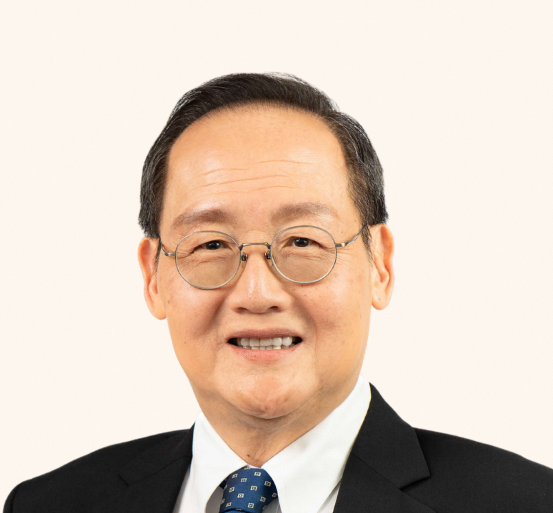 Minister Dr Tan See Leng in suit and tie, smiling at camera.
